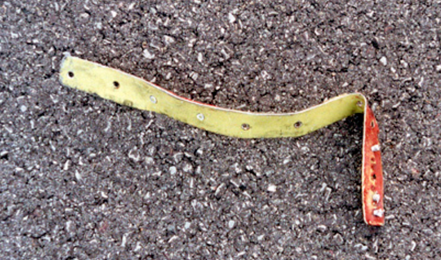 A metal strip not belonging to Concorde that was found next to the runway after AF 4590 departed. Investigators believe it was this debris that punctured the SST’s tire. (BEA)